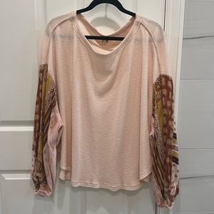 Free People pink sweater with pattern sleeves